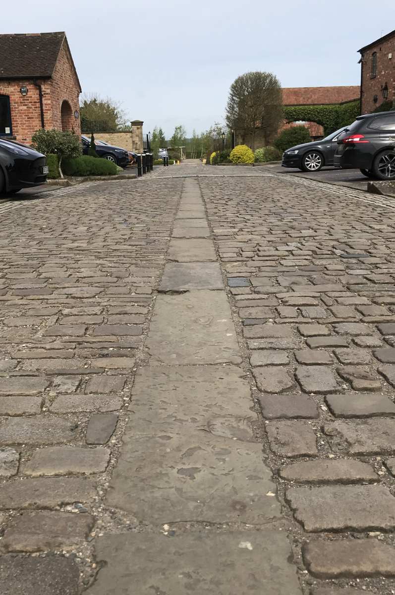 Reclaimed antique Yorkstone paving and granite cobbles used in a new business park