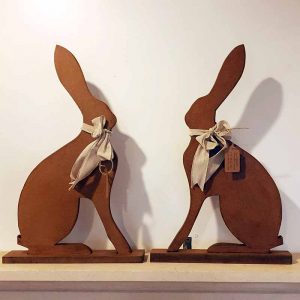 Handcarved wooden sitting hares ornament for country home