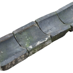 Weathered blue gully bricks, ready for installation as irrigation or drainage system