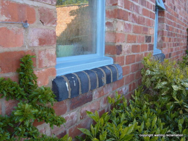 Blue bullnose bricks used as a windowsill