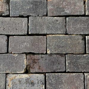 Staffordshire Blue paving bricks showing smooth worn faces and weathered patina, recovered from a large garden near Tiffield, Northamptonshire