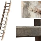 An antique wooden loft ladder with mortice and tenon joints and a fabulous patina that shows true character