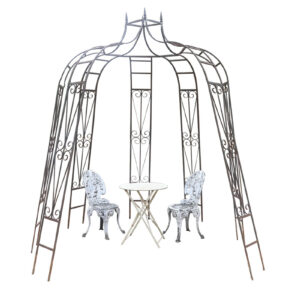 Antique octagonal gazebo showing an aged patina and unique structure.
