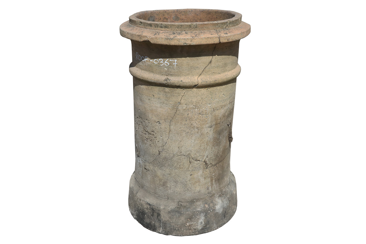 A reclaimed buff, banded chimney pot showing marvellous patina of age related stains and cracks.