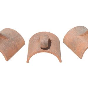 Three reclaimed decorative finial ridge tiles showing consistent weathering and rich terracotta colouring