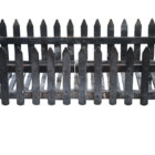 Fence style fire basket showing weathering from prior use and sturdy cast iron construction