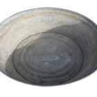 Large reclaimed galvanised metal tub or planter showing an aged patina and signs of previous use.