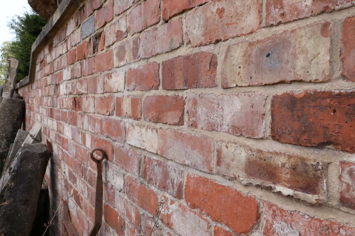 A long wall built with antique Tudor bricks