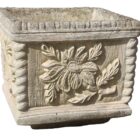 A reclaimed, light coloured composite stone planter displaying an oak tree design.