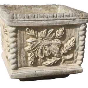 A reclaimed, light coloured composite stone planter displaying an oak tree design.