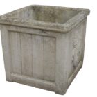 A squirrel motif planter showing the aged patina of a reclaimed garden feature
