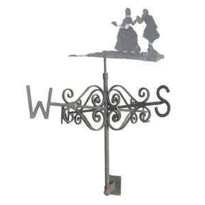 A reclaimed wall mounted weathervane depicting a Regency couple and showing light weathering from years of exposure to British weather