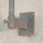 A reclaimed wall mounted weathervane mounting bracket showing discolouration and mild surface corrosion