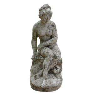 A reclaimed statue of Andromeda in classic pose and showing a finely weathered surface