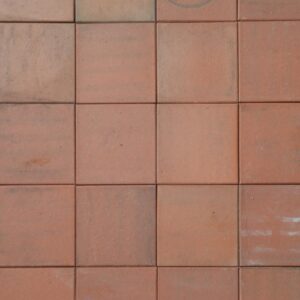 Reclaimed red 6 inch Ruabon quarry tiles showing mild weathering and a rich terracotta colour