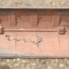 Redland 3 Hole Crested Ridge Tile showing the underside and original red colouring 3 ROOF-0366