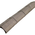 Reclaimed Universal concrete ridge tiles showing their weathered surface and aged brown colour