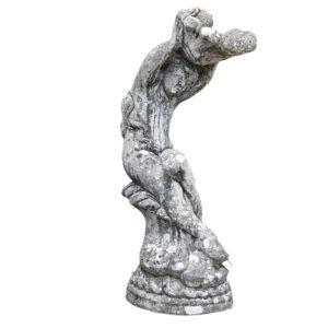 A heavily weathered birdbath depicting a cherub holding a shell, with a fabulous aged patina
