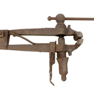 A reclaimed, antique blacksmiths post vise, showing heavy surface corrosion but is complete with original spring