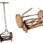 An antique push mower from the early 1900's, named The Trojan, from US manufacturer F & M Lawn Mower Co. in The USA.