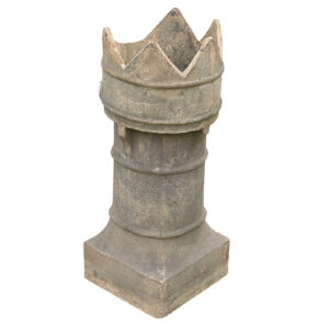 A reclaimed buff earthenware chimney pot with a crown top, showing an age worn patina and one broken palisade, or point