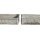 A pair of weathered composite stone balcony pots with a fine, light patina
