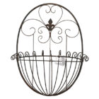 A reclaimed antique French style wall basket with fleur de lis motif and delicate wire scroll work.