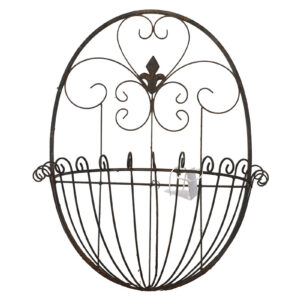 A reclaimed antique French style wall basket with fleur de lis motif and delicate wire scroll work.