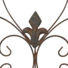 Detail of a French style wall basket with delicate scroll work and a decades old weathered patina