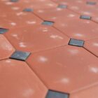 A new, old stock, batch of 12sqm octagonal ferrolite terracotta tiles by Daniel Platt and Sons, in excellent condition