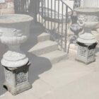 A pair of weathered composite stone plinths showing a light patina of lichen and mild discolouration, perfect for small courtyards and gardens