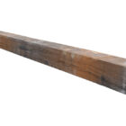 A reclaimed oak railway sleeper showing an aged patina and signs of prior use