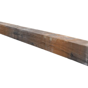 A reclaimed oak railway sleeper showing an aged patina and signs of prior use