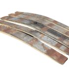 Reclaimed whisky barrel staves showing the natural curve and a weathered patina of age and iron hoops
