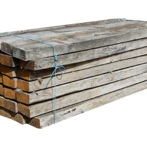A large batch of seasoned but unused oak sleepers with a silvered patina that helps them blend into established garden designs