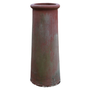 A tall red roll top chimney pot with a weathered patina