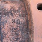 terracotta disused chimney caps showing light patina and signs of prior use