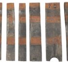 Reclaimed whisky barrel half staves showing the individual sizes and unique weathered patina