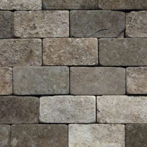 Reclaimed and weathered blue buff limestone setts showing tumbled and worn edges and a fabulous patina