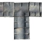 A unique and weathered collection of blue double stable gully pavers with both straight and T sections