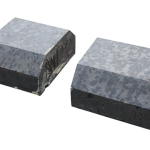Reclaimed solid blue double cant end copings with a light patina and remnants of mortar