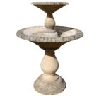 A weathered reclaimed Haddonstone Arcadian Double fountain showing the aged patina of long years spent exposed to the British weather