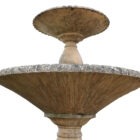 The underside of the bowls on a weathered reclaimed Haddonstone Arcadian Double fountain showing the aged patina of water flow discolouration