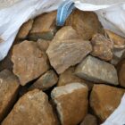 A bulk bag of reclaimed ironstone cock & hen walling showing the rich colours of Northamptonshire ironstone that's so popular across the East Midlands