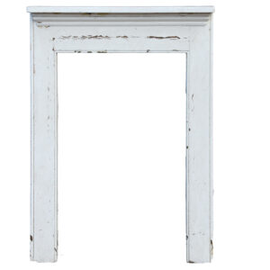 A white painted reclaimed pine fire surround showing its age through peeling paint and worn edges