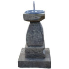 A heavily weathered reclaimed Yorkstone and lead sundial showing a beautiful aged patina