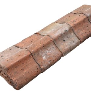A batch of reclaimed flat top red brick Bishops Hat wall copings with a light patina
