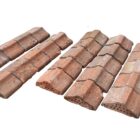A batch of reclaimed flat top red brick Bishops Hat wall copings with a light patina