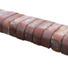 A run of reclaimed red double bullnose bricks with an authentic weathered finish from decades exposed to the elements.