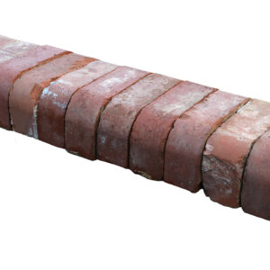 A run of reclaimed red double bullnose bricks with an authentic weathered finish from decades exposed to the elements.